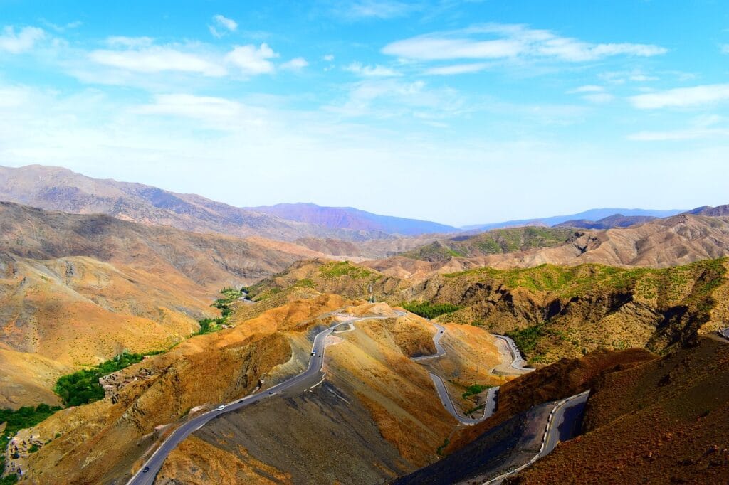 Scenic view of winding roads through the Atlas Mountains, a highlight of Morocco travel.