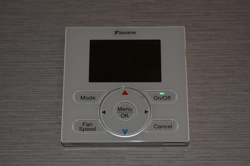 Wall-mounted smart thermostat with digital controls, among the best smart home devices